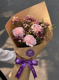 Rustic Charm: Pink Carnations in Kraft Wrap